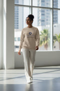 Beige sweatshirt with Koolmedz Living logo and text on a white background