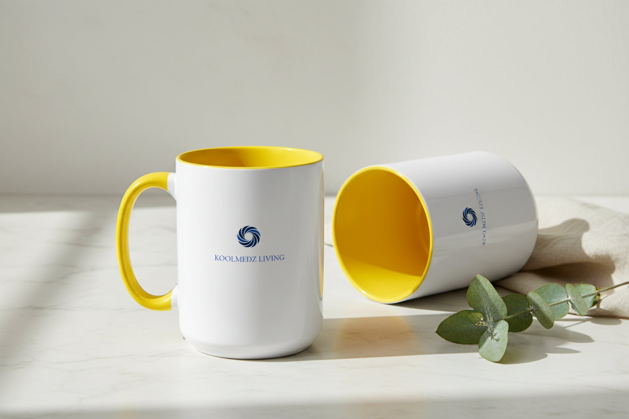 Ceramic accent mug with yellow rim and handle, white body, blue logo; inside visible