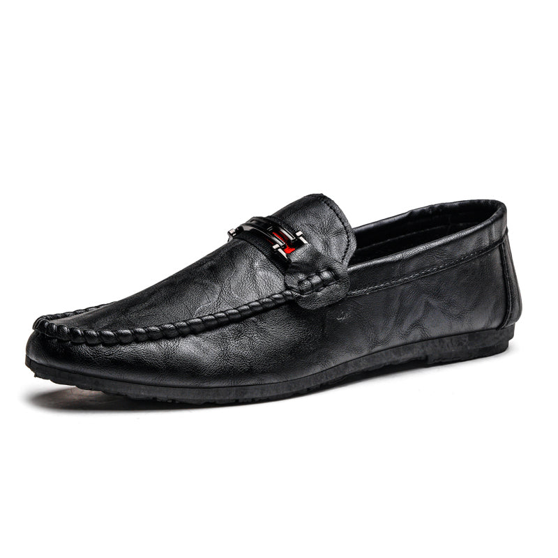 Black moc-toe slip-on loafer with strap detail and textured upper