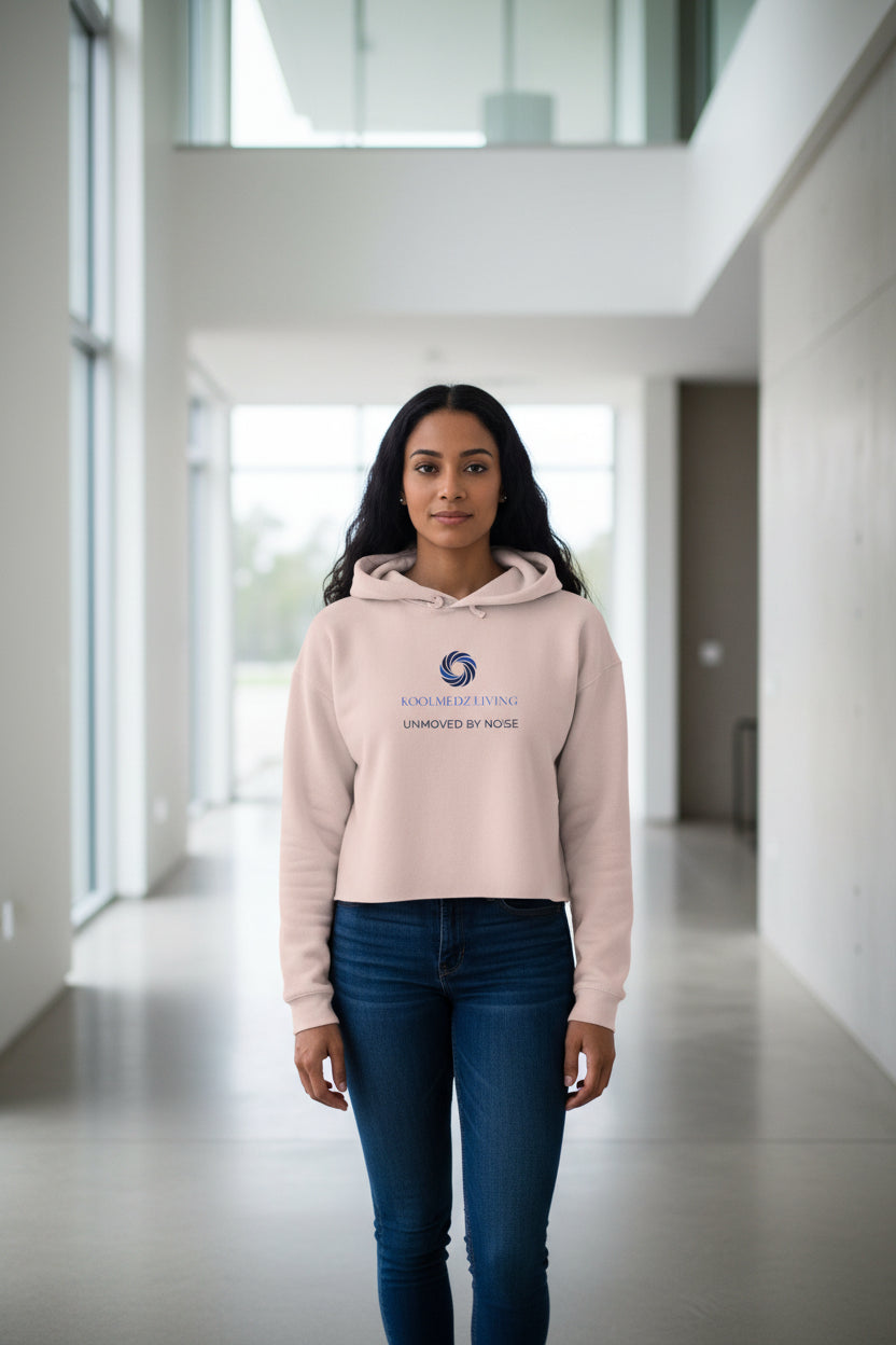 Pink cropped hoodie with a logo and text on a white background