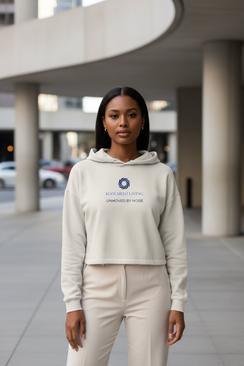Cream cropped hoodie with drawstring hood and chest logo print