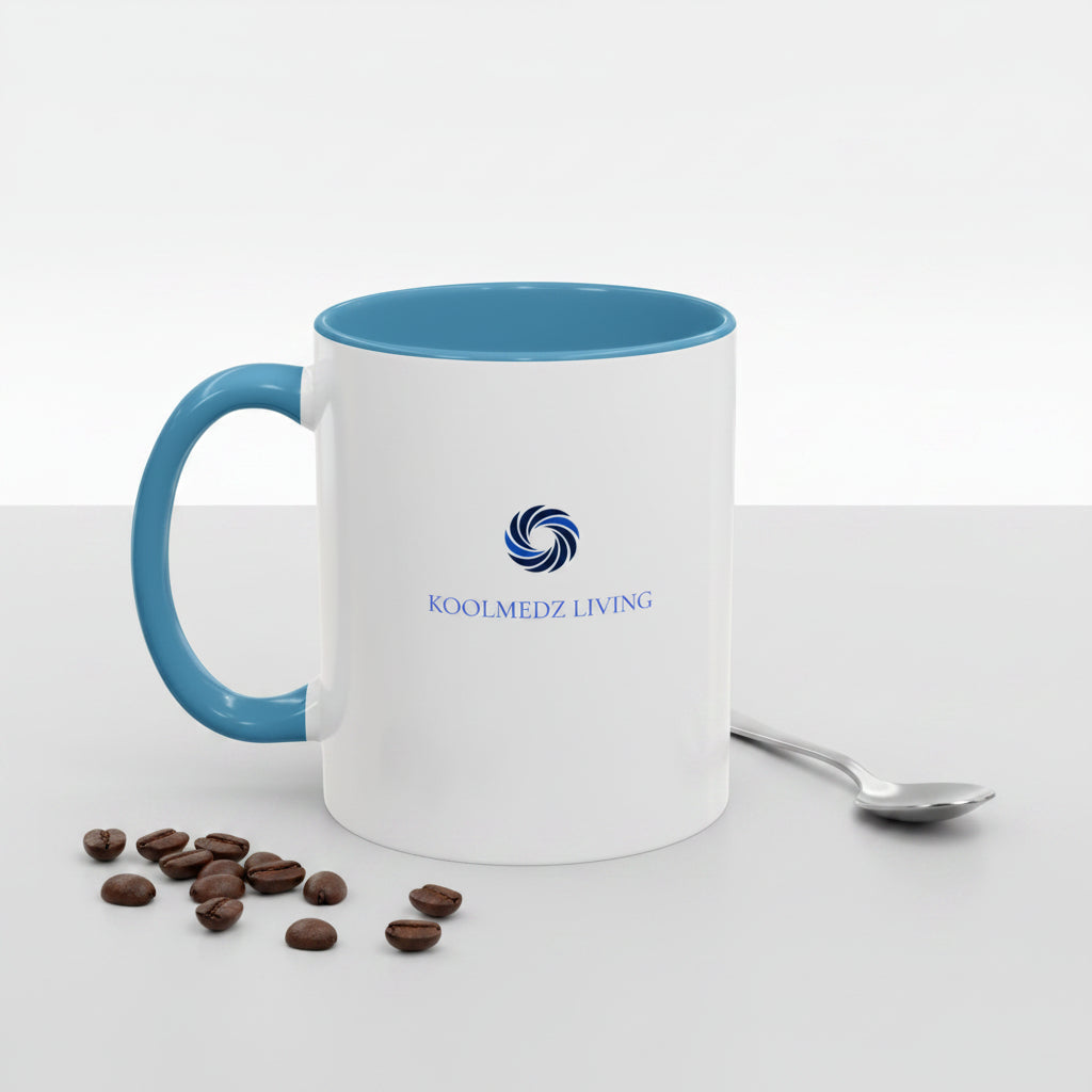 Ceramic mug with light blue handle and rim, white body and KoolMedz Living logo