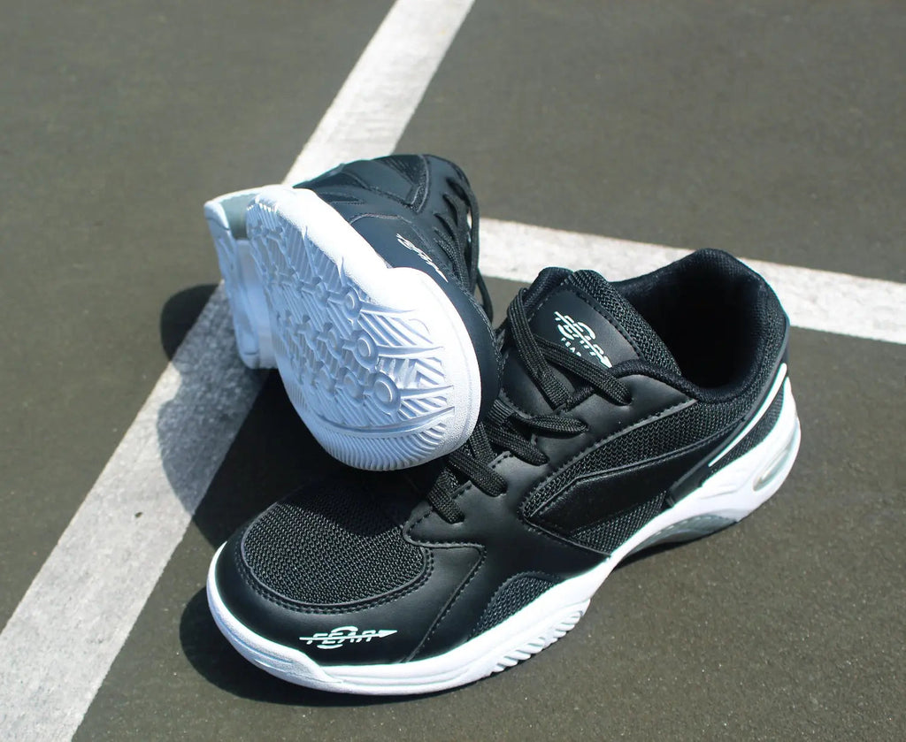 Black men's walking sneakers with white midsole and lace-up front close-up