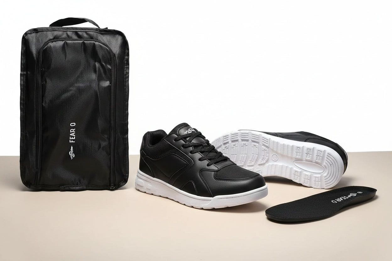 Black men's walking sneakers with white sole, reusable shoe bag, and insert