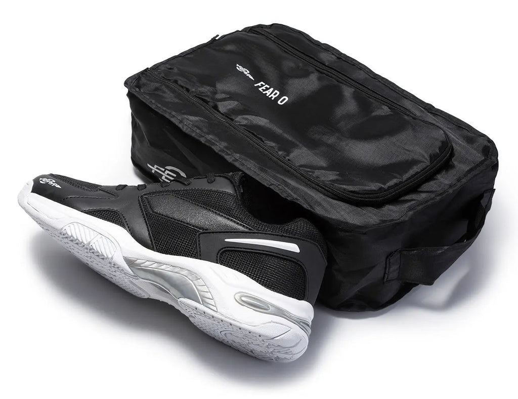 Black men's walking sneakers top view with matching black shoe bag