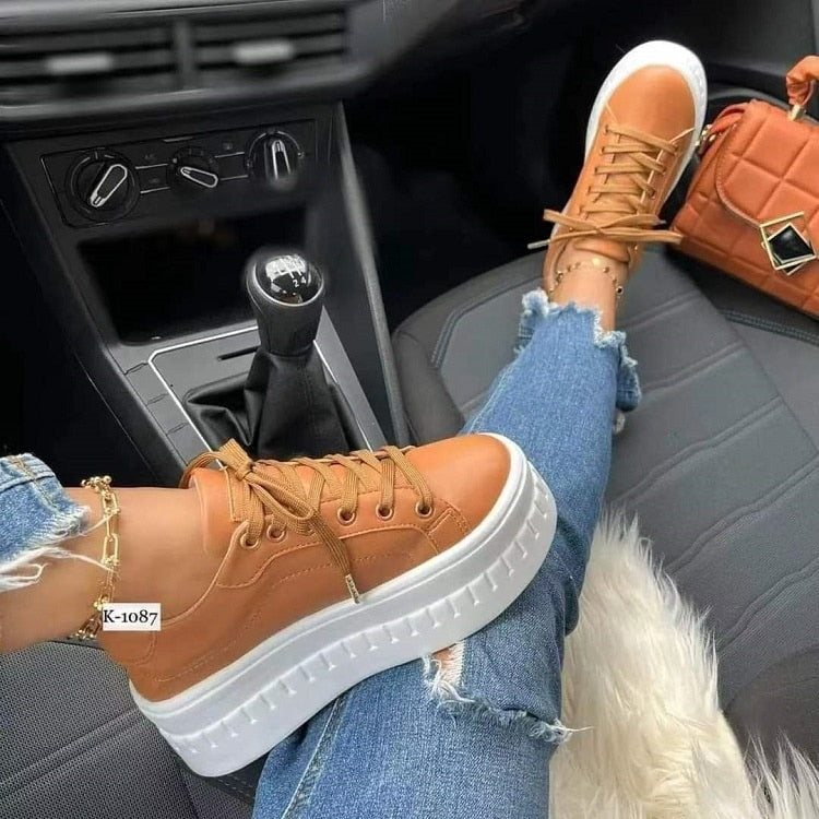 Women’s platform sneakers in tan leather with lace-up front and white rubber sole