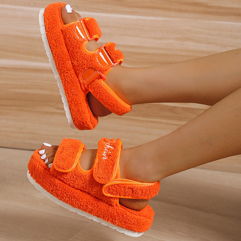 Orange textured platform sandals with two hook-and-loop straps and open toe