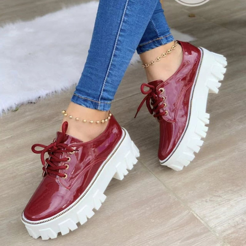 Wine red glossy platform lug-sole lace-up shoes with thick white tread and laces