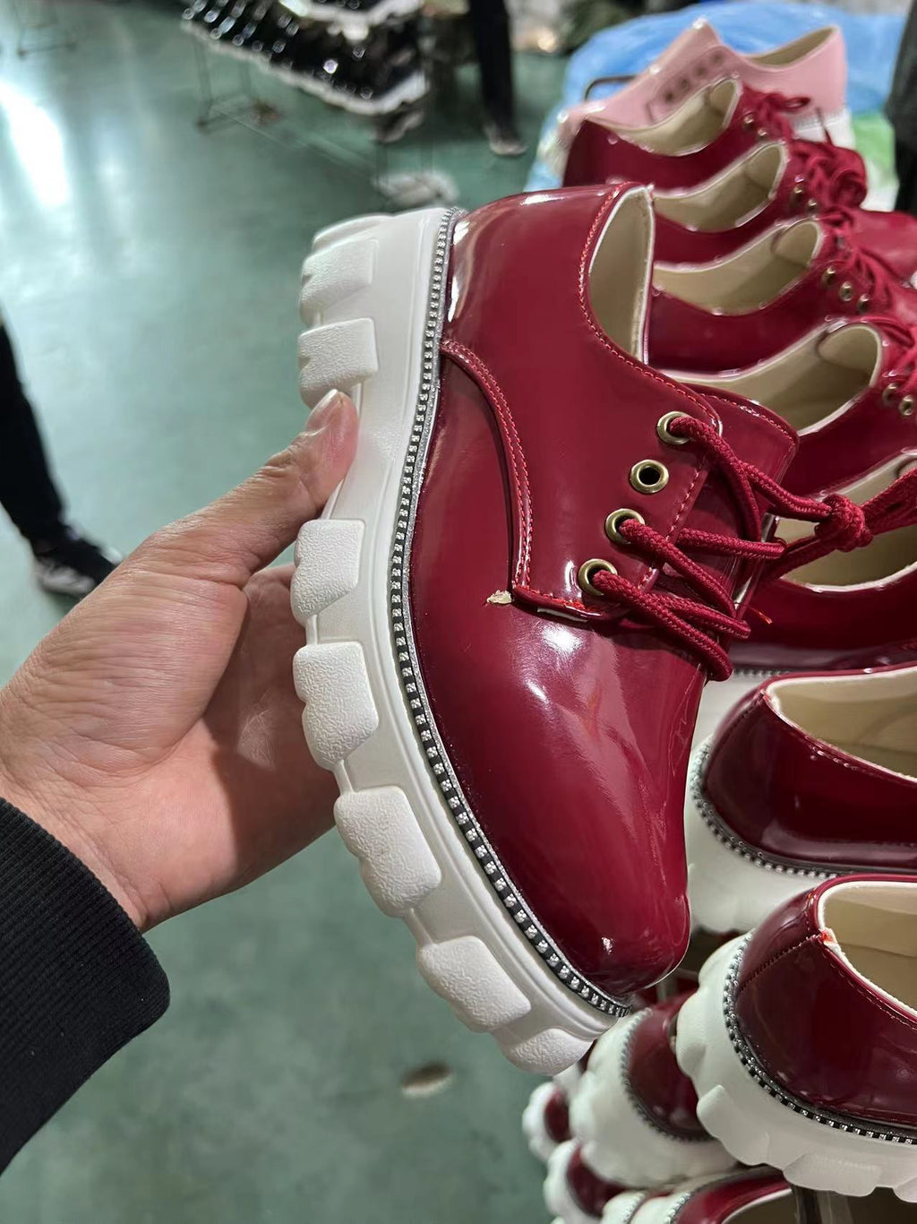 Burgundy glossy platform lace-up shoes with thick white lug sole and gold eyelets
