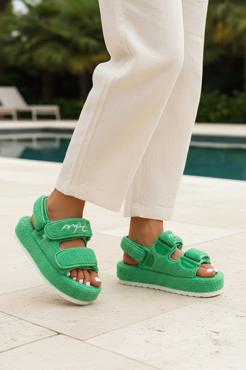 Green textured platform sandals with hook-and-loop straps and open toe