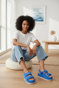 Blue textured platform sandals with hook-and-loop straps and open toe