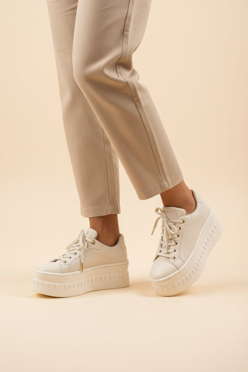 Women’s platform sneakers in white with lace-up front and chunky white rubber sole