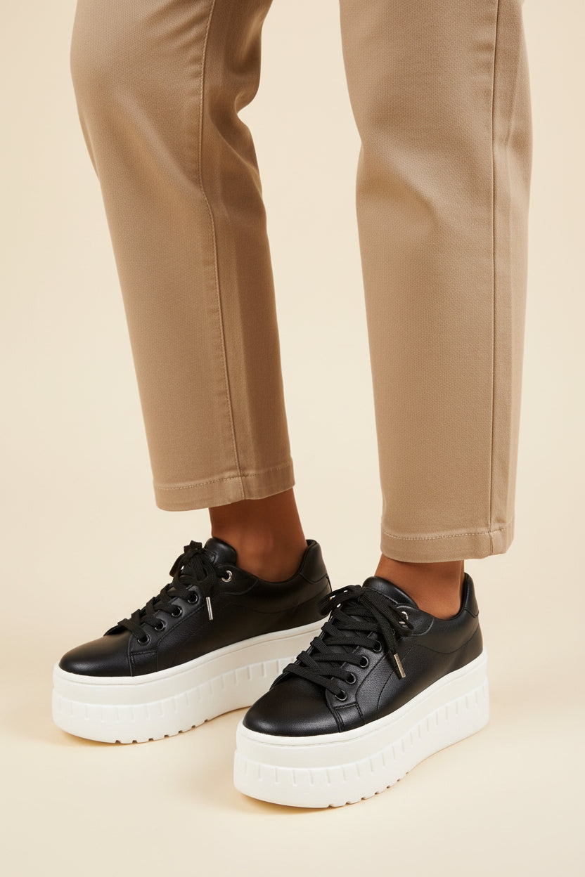 Women’s platform sneakers in black with lace-up front and thick white rubber sole