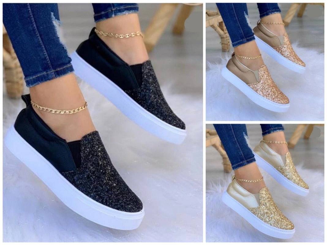 Women’s black and gold glitter platform slip-on sneakers with white soles.
