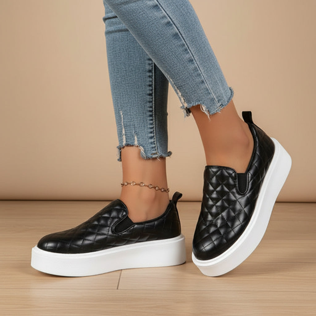 Black quilted slip-on platform sneaker with white outsole and low back