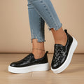 Black quilted slip-on platform sneaker with white outsole and low back