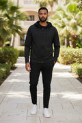 Men's black zip-up hooded jacket with front zipper and hanging drawstrings
