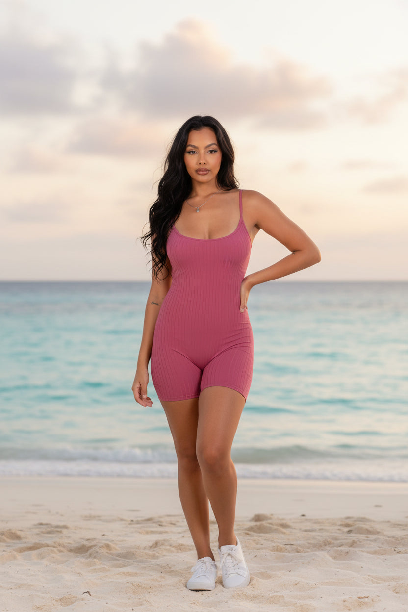 Pink ribbed bodycon romper with spaghetti straps and short legs
