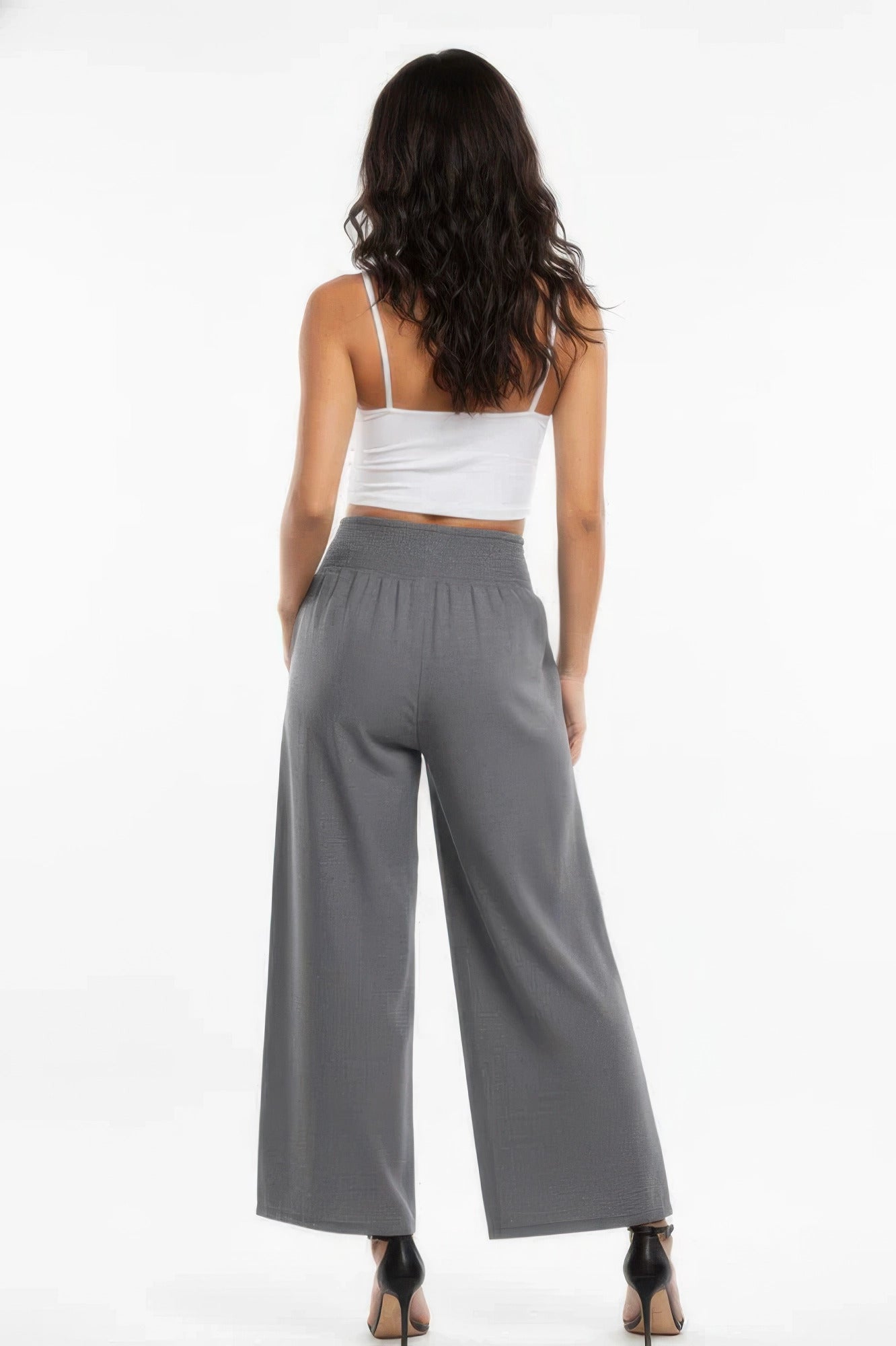 Back view of high-waisted wide-leg lounge pants in dark gray with elastic waist