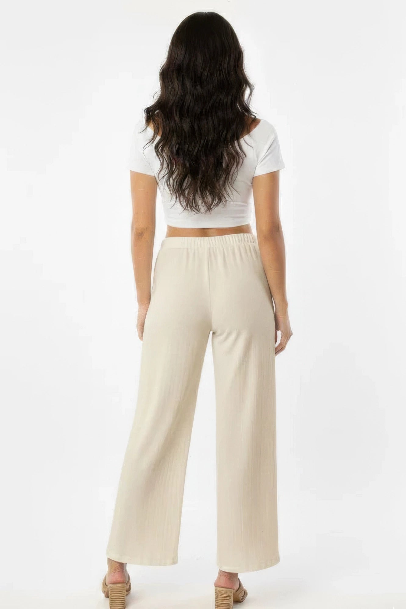 Off-white wide-leg cotton pants, rear view full-length