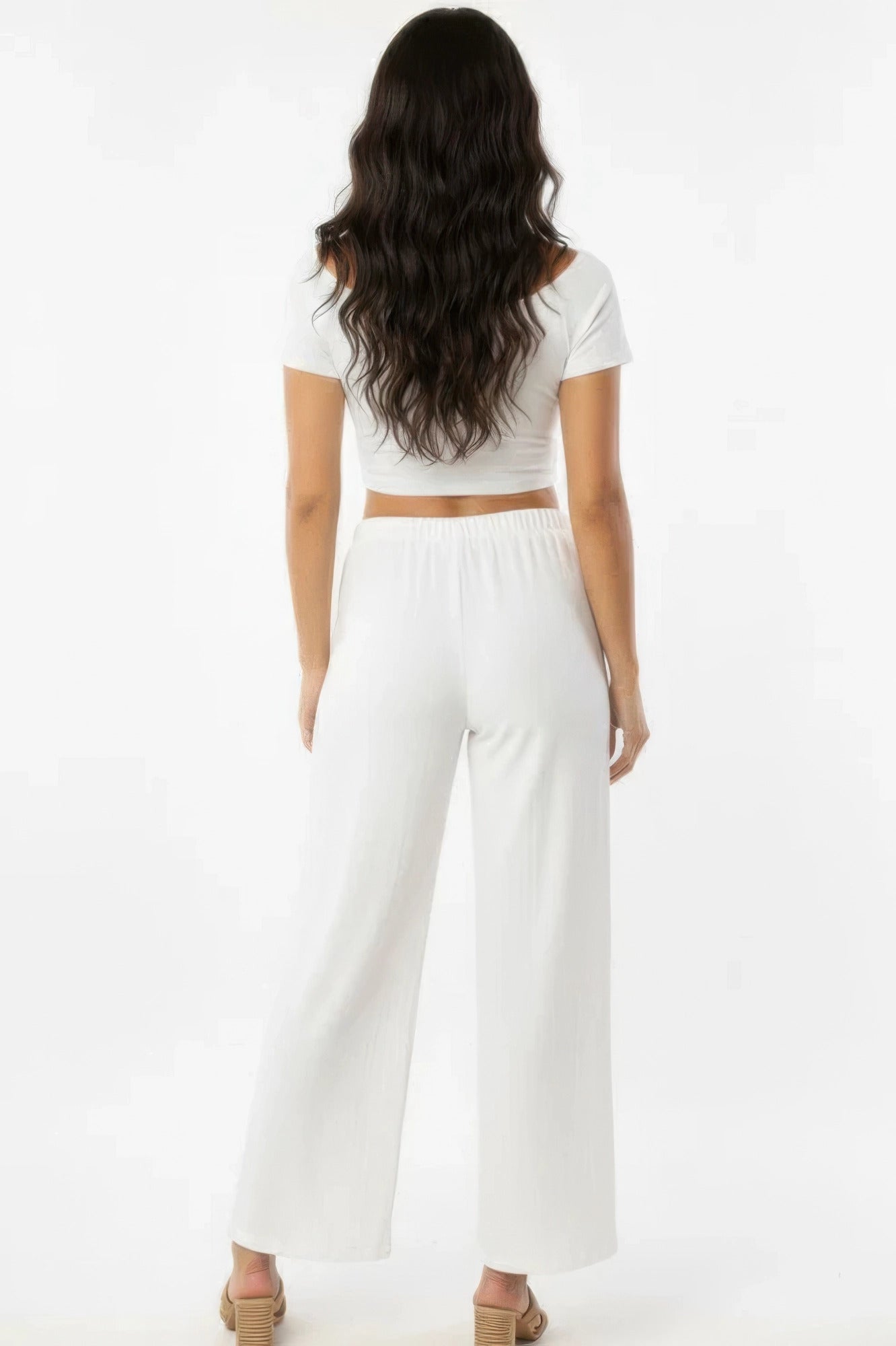 Off-white wide-leg cotton pants, back view with elastic waistband