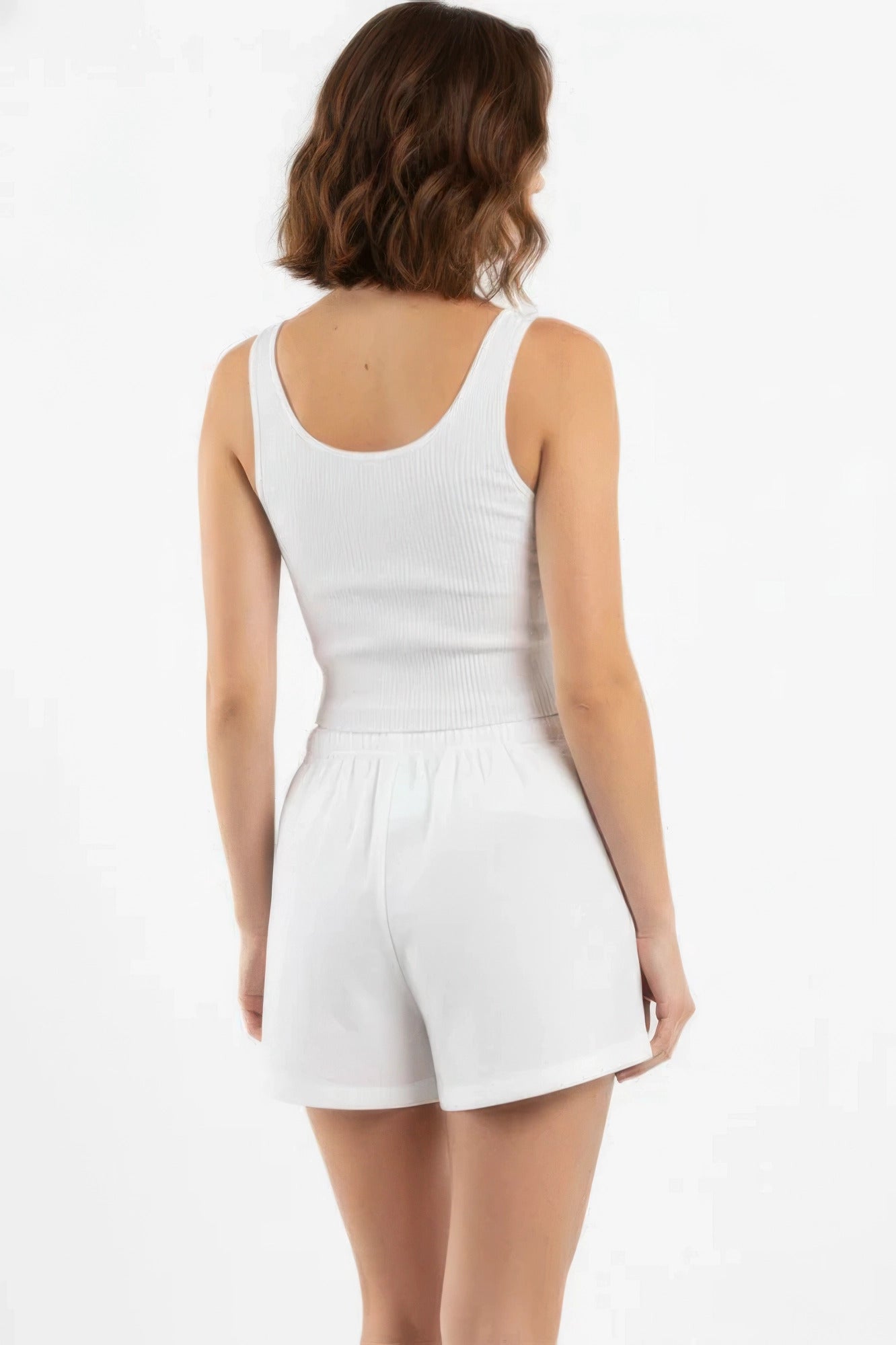 Off-white cotton comfort shorts shown from the back with elastic waistband
