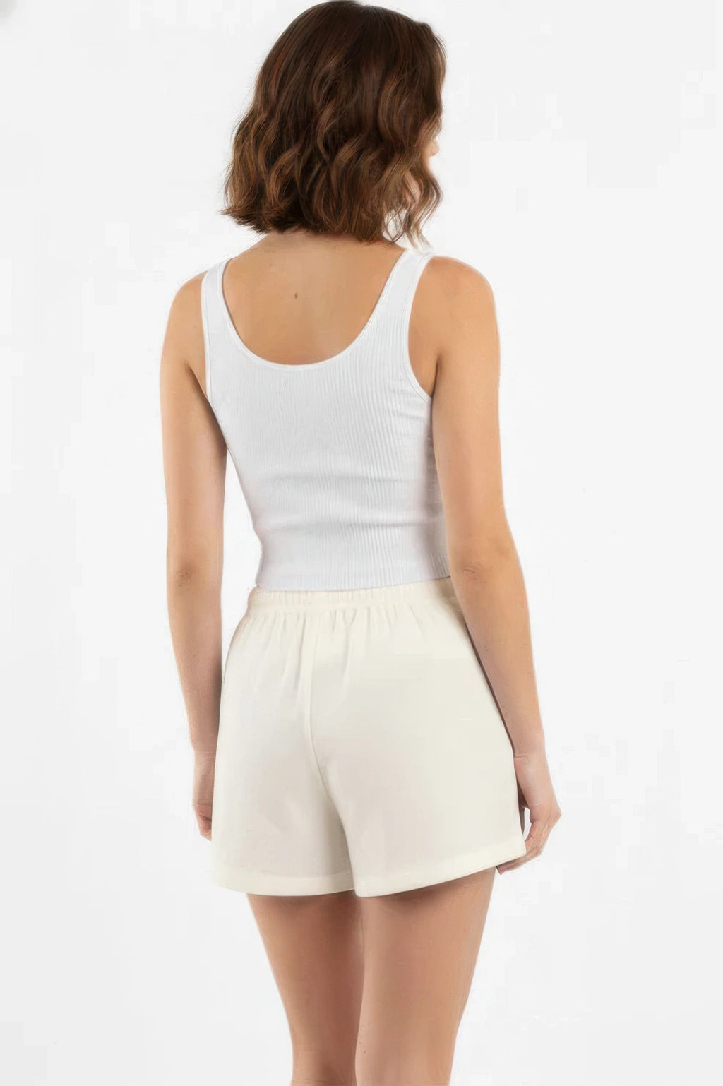 Off-white cotton comfort shorts shown from the back with elastic waistband