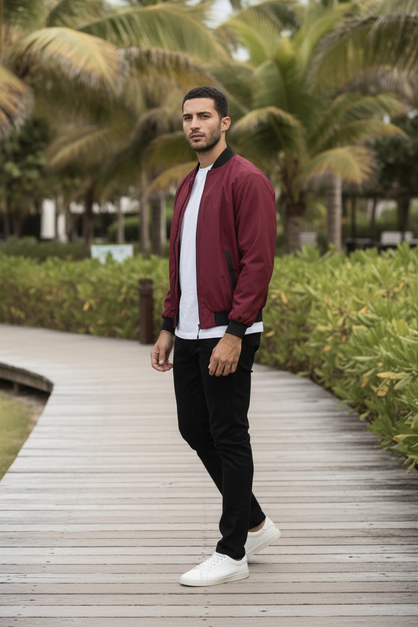 Lightweight burgundy windbreaker jacket, side profile with ribbed hem and cuffs