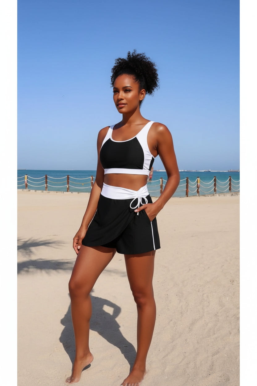 Two-piece color block high-waist bikini set, black top with white trim and tie-front bottom
