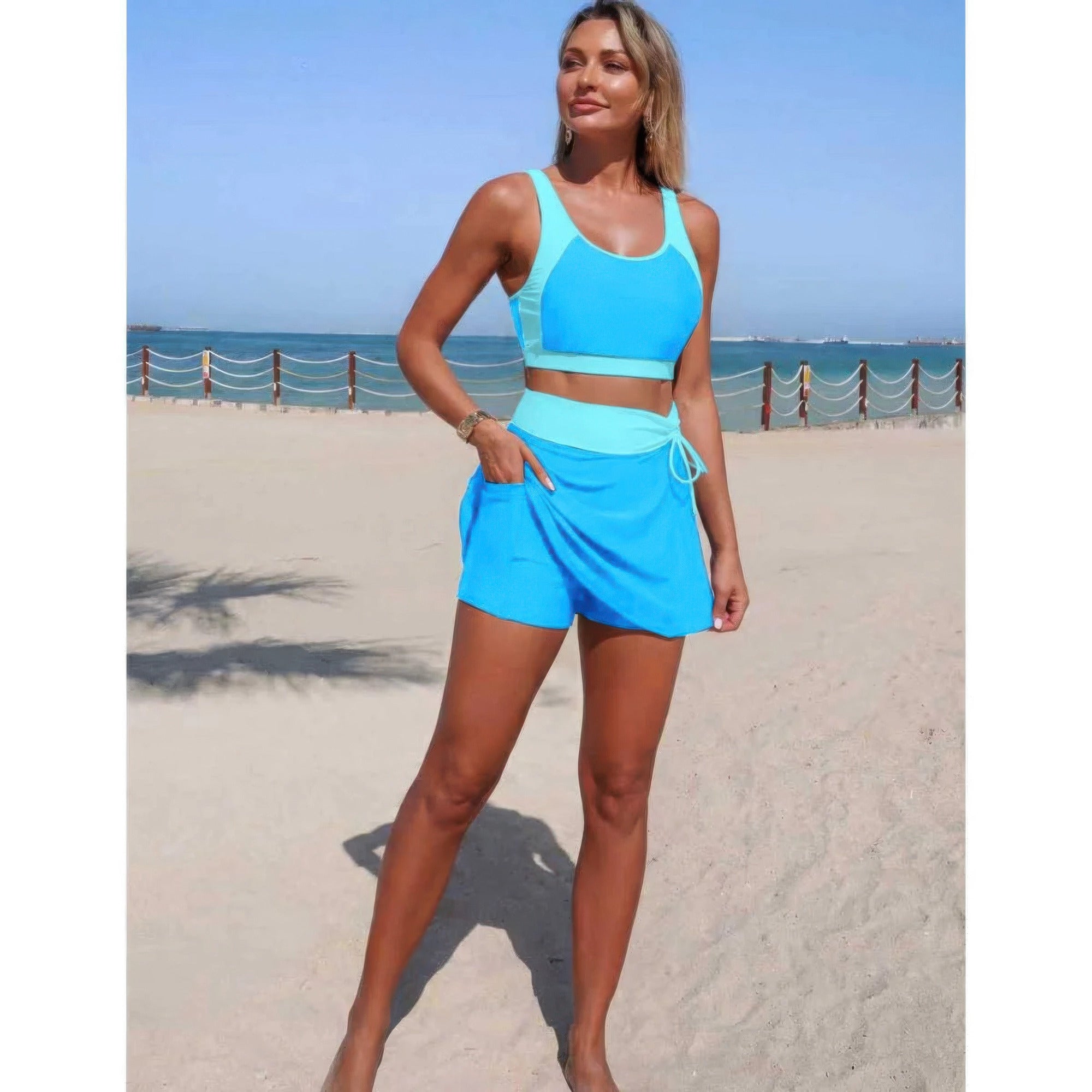 Two-piece color block high-waist bikini set, light blue top with white trim and tie-front bottom