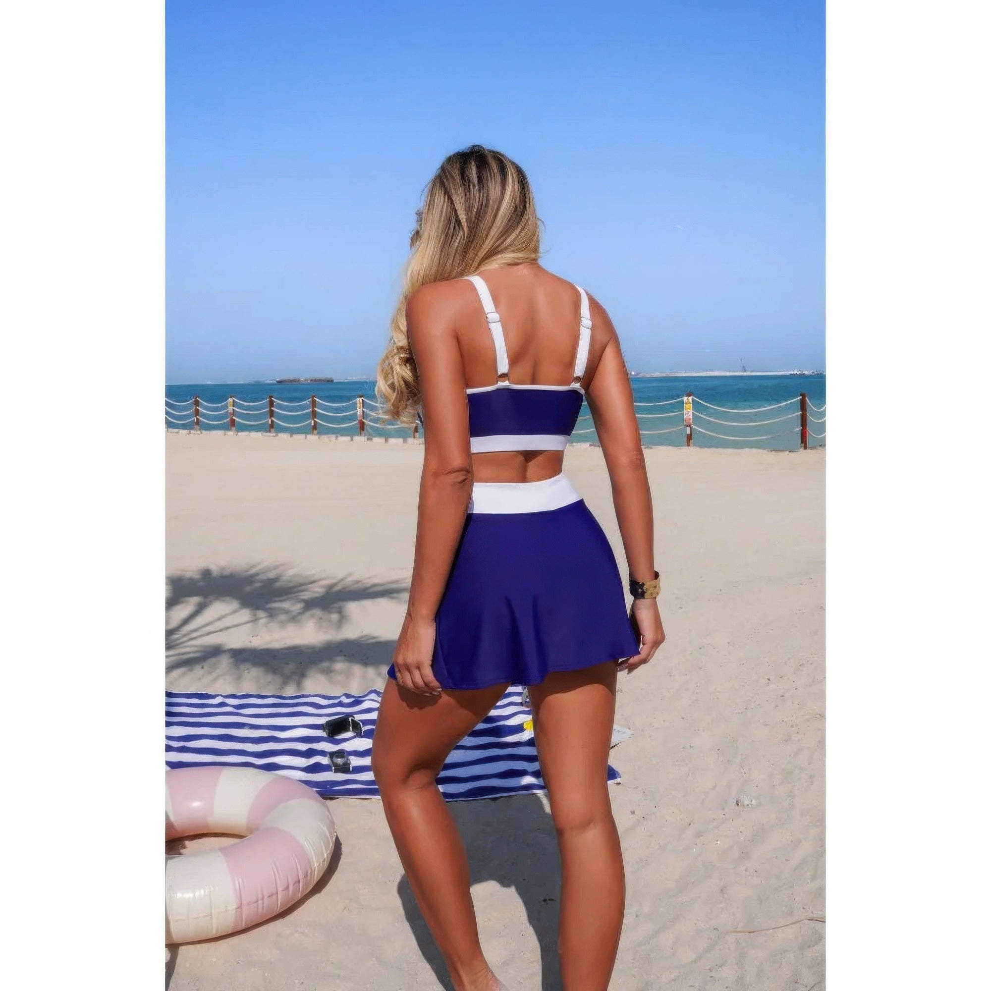 Two-piece color block bikini set, navy high-waist tie-front mini skirt with crop top back