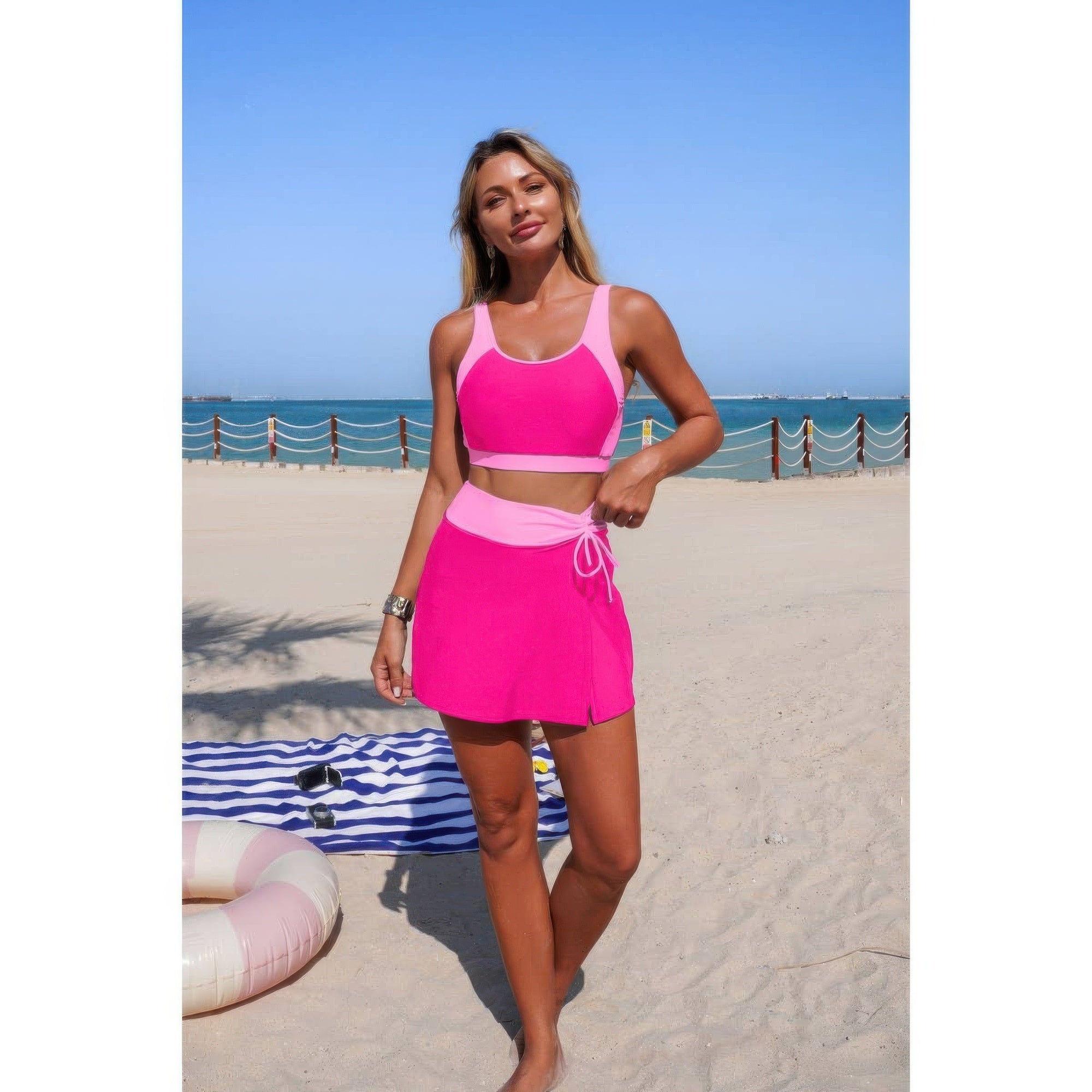 Pink color-block bikini top with high-waist tie skirt, sleeveless