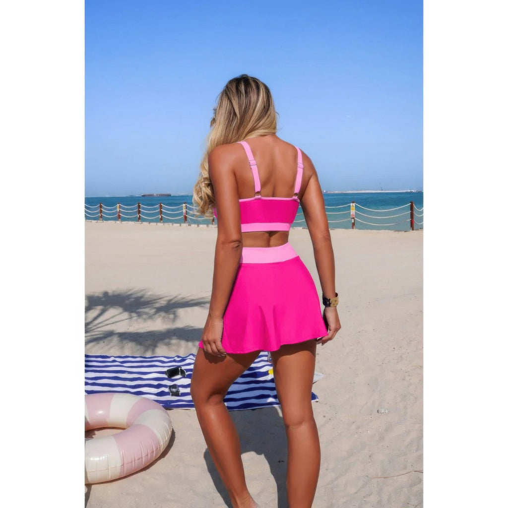 Pink color-block bikini set with high-waist tie skirt, back view