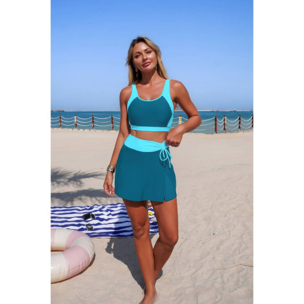 Teal color-block bikini top with high-waist tie skirt, sleeveless