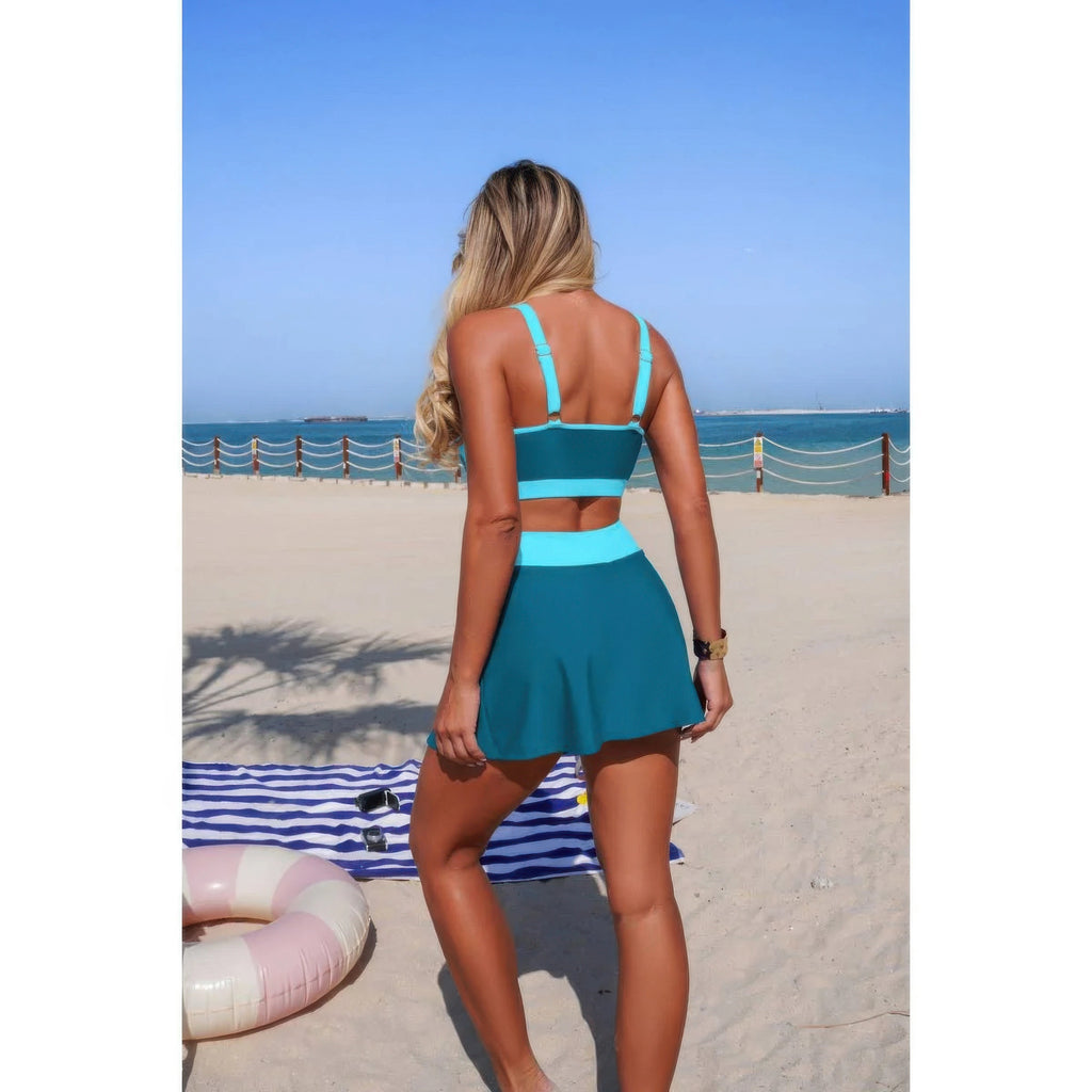Teal color-block bikini set with high-waist tie skirt, back view