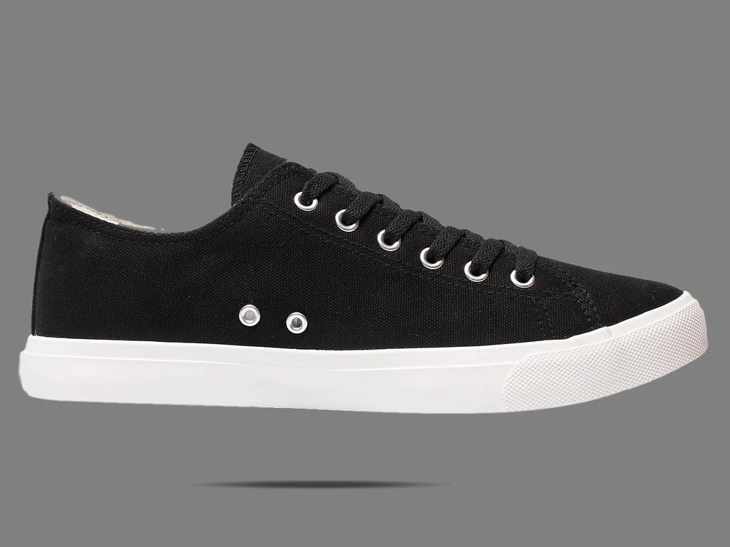 Black canvas low-top sneakers with lace-up eyelets and white rubber sole