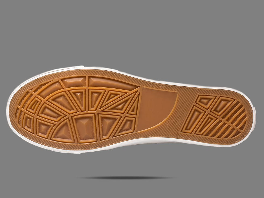 Brown rubber sneaker outsole with geometric tread pattern