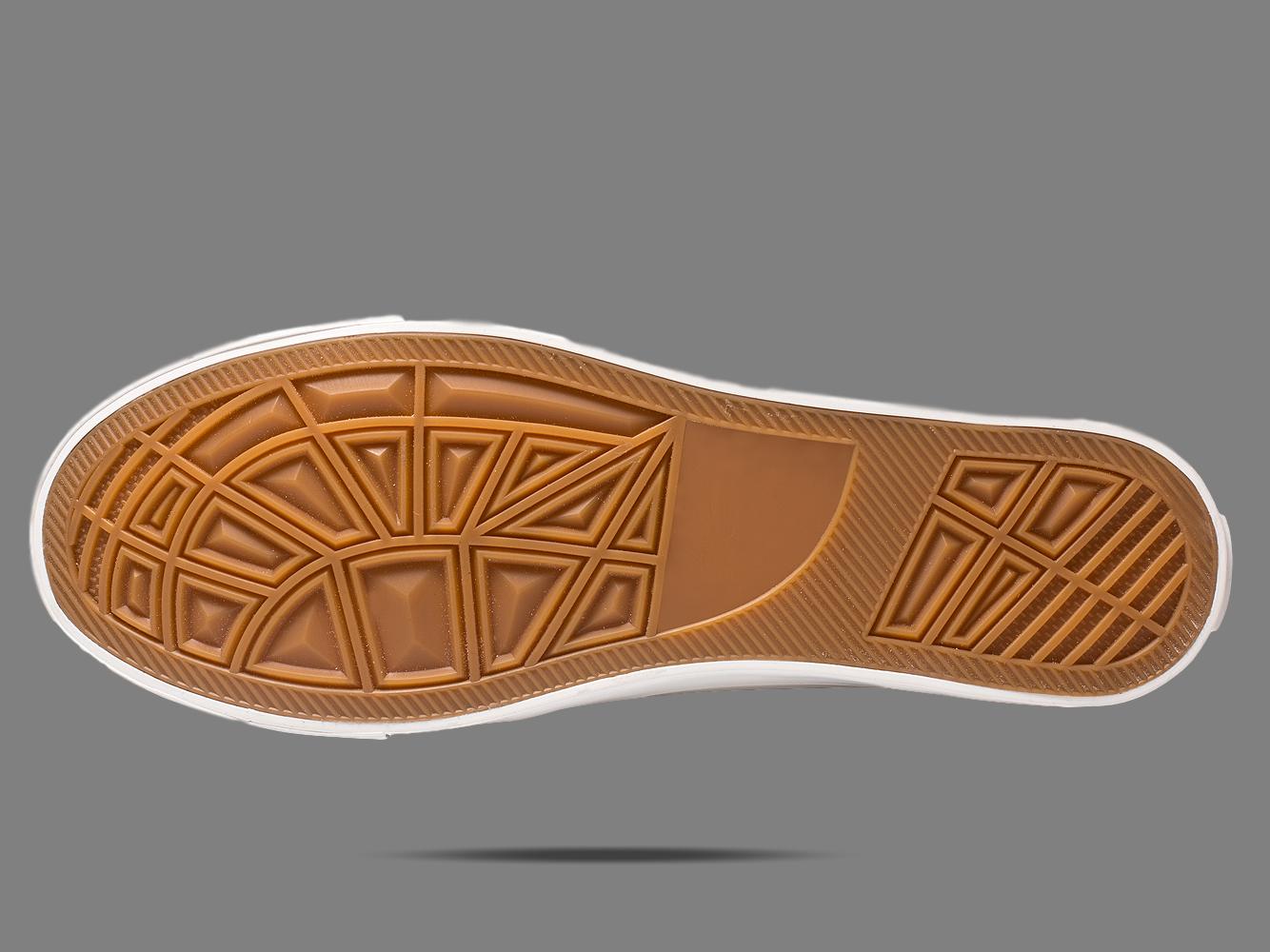 Brown rubber sneaker outsole with geometric tread pattern