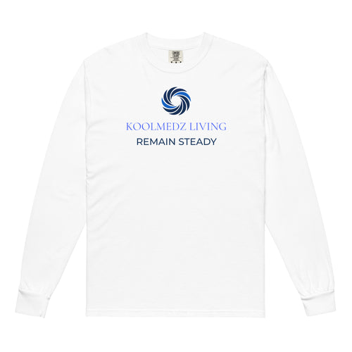 A white long-sleeve t-shirt with a blue and navy graphic on the chest featuring a swirl logo and the text 'KOOLMEDZ LIVING' and 'REMAIN STEADY'.