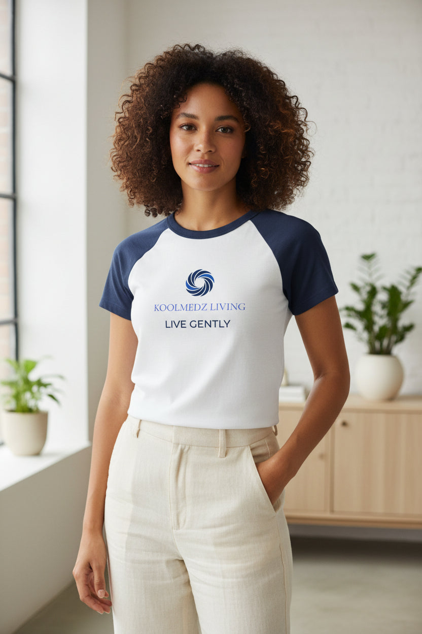 White raglan baby tee with navy sleeves and front logo graphic