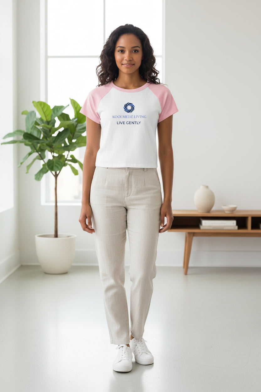 White raglan baby tee with pink sleeves and front logo graphic